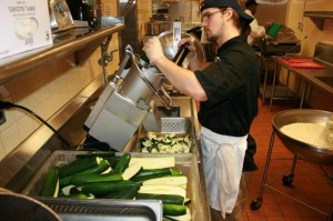 Steve Brock, a culinary pro, feeds the pre-trimmed squash into the chopper. This fall Steve is headed to the Culinary Institute of America in the Hudson River Valley of New York. Best wishes to Steve in his culinary journey.