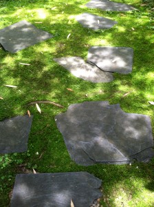 Moss creeps between the slate stepping stones.