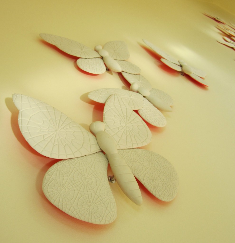 New York City Artist Nancy Blum created this installation of large-scale butterflies made from cast china clay.