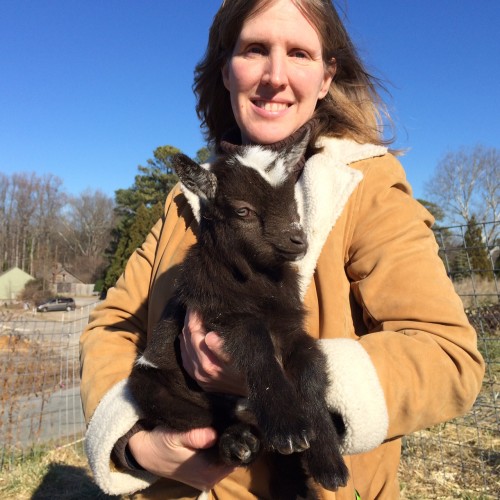 Kristi Orcutt and Solstice the 9-day-old black and white goat