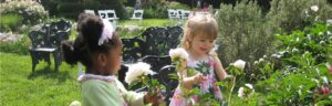 Friends smelling the peonies on Mother's Day