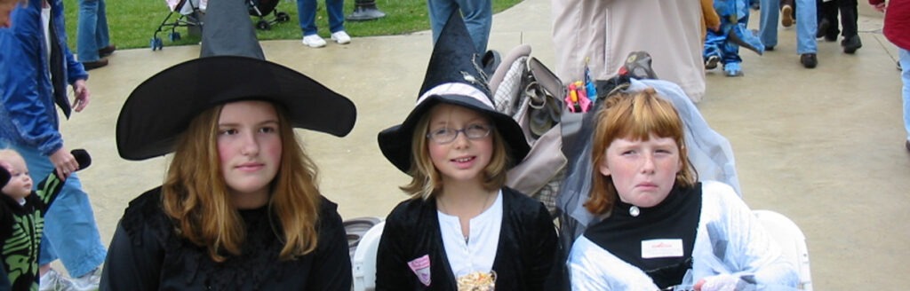 Three girls in witch costumes - Lewis Ginter Botanical Garden