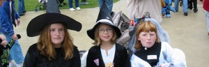 Three girls in witch costumes