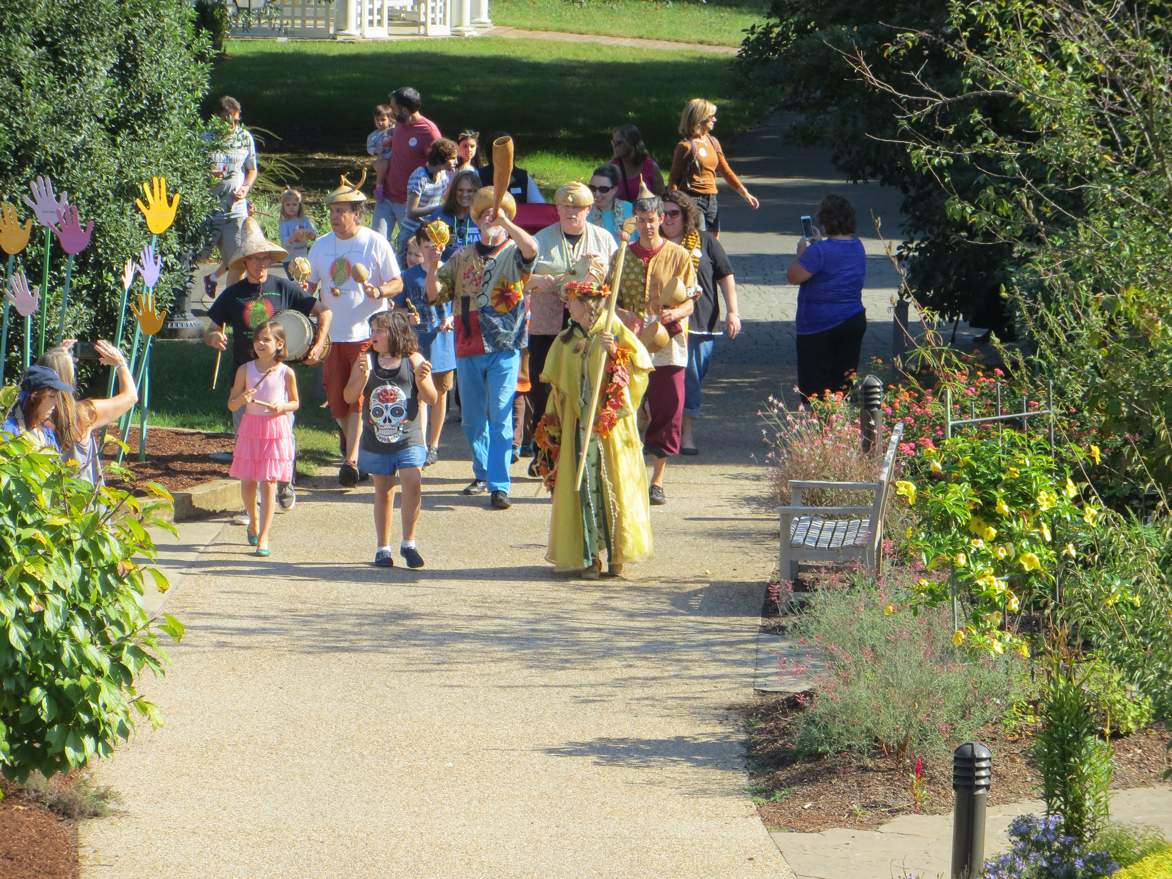 Parade with band at Goblins and Gourds event in the Children's Garden