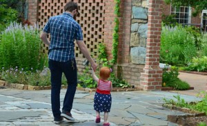 Dad and Child exploring the Garden