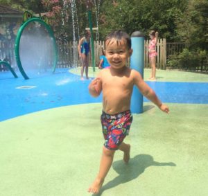 kid in water playing