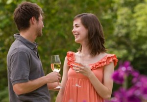 Young couple drinking wine in the Garden at Flowers After 5 Concerts
