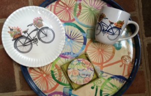 coaster, plate, coffee mug and serving tray with bicycle motifs