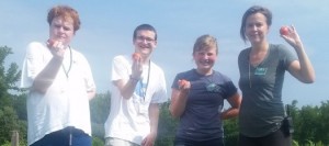 Volunteers from the Founder’s Center along with Service Learning Intern Kittie Storey and Youth Programs Developer Nicki Apostolow, as they harvest tomatoes.