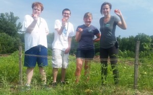 Volunteers from the Founder’s Center along with Service Learning Intern Kittie Storey and Youth Programs Developer Nicki Apostolow, as they harvest tomatoes.