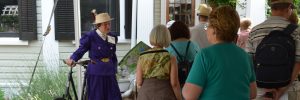 Garden volunteer Sherry Geise talking to visitors taking the group tour From Bicycle Club to Botanical Garden
