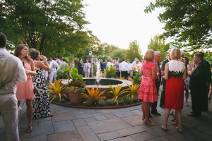 Wedding guests gather outside on the Fountain Terrace. Image by Don Mears Photography.