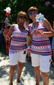 two adults having fun at carmax free fourth of july