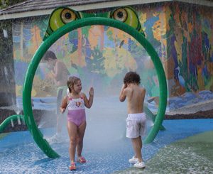 two kids playing in water play