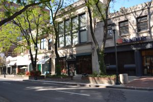 City streets are naturally charming when planted with green spaces and trees.