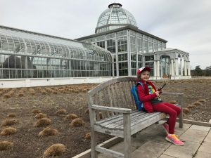 girl playing pokemon at lewis ginter botanial garden