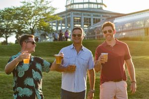 Celebrating garden grown Cascade hops in Center of the Universe Brewing - Lewis Ginter Botanical Garden Cascade Citrus Ale at A Garden Soiree at Lewis Ginter, 3 guys drinking beer.
