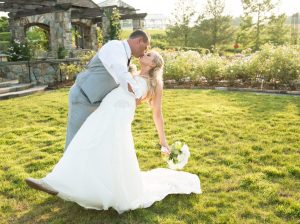 Outdoor wedding venues at the Rose Garden surround you with rose blooms. Image by Caroline Martin Photography.