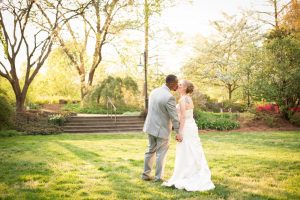 Newly married couple taking pictures throughout Flagler Garden. Image by Joanna Hartsook Photography.