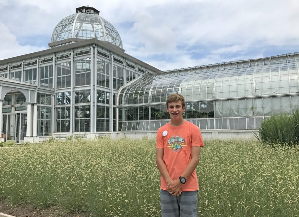 Summer camp volunteer Jacob in front of the Conservatory.