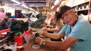 Man organizes lights and props.