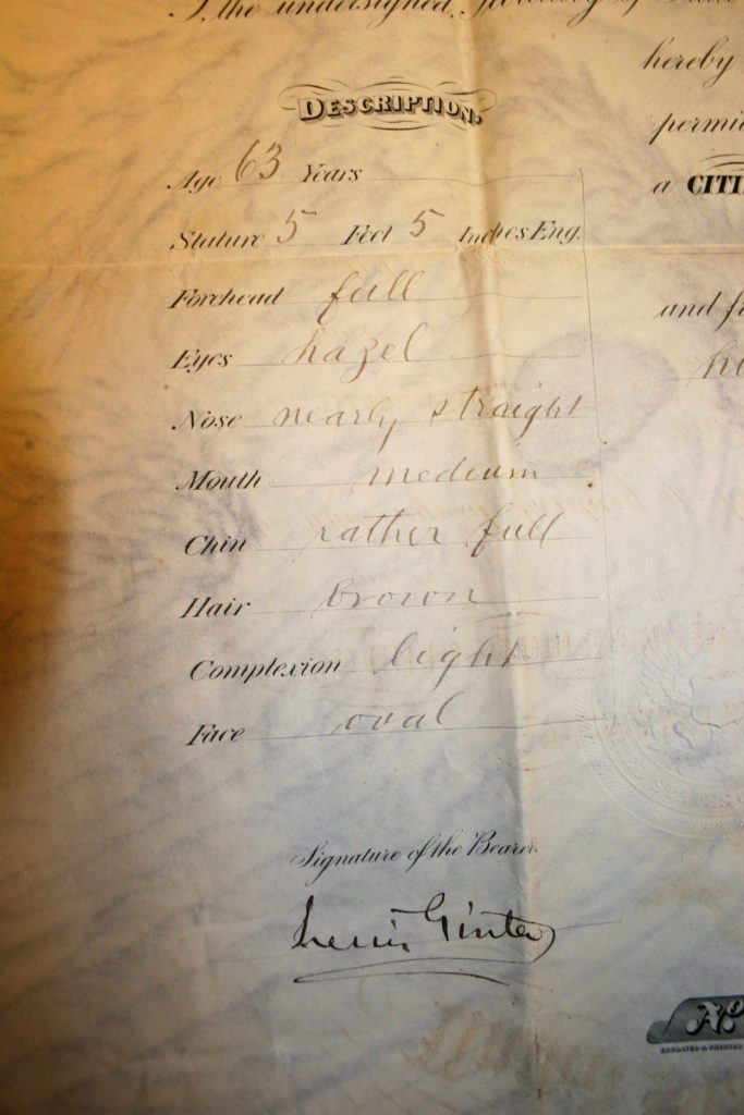 Details of this portion of Lewis Ginter's passport go over a written description of the man. 