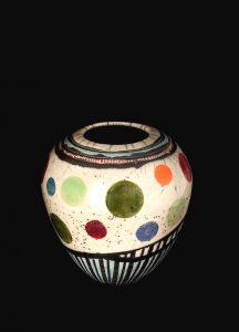 Colorful pottery in white, green, orange and blue.
