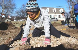 Elisa Bennett digging in the dirt.