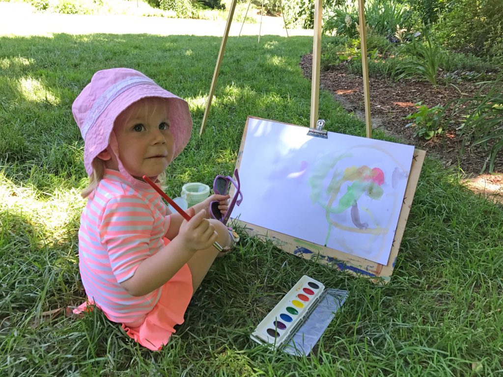 girl painting outside en plein air 