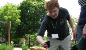 a young man planting as a form of Therapeutic Horticulture: