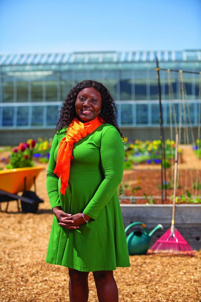 Lakeshia Allen stands in a community garden