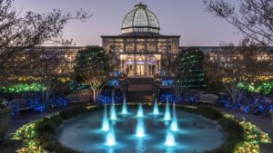 The Conservatory illuminated at night during GardenFest