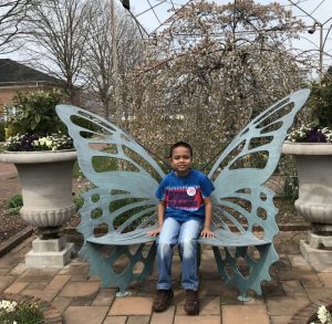 Brayden from World Pediatric Project touring the Garden