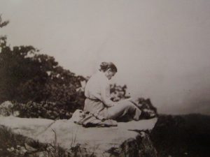 Image of Grace Arents on rock