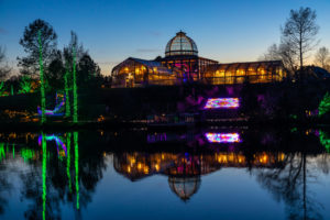 Dominion Energy GardenFest of Lights image of the Conservatory and the lake. Image by Tom Hennessy