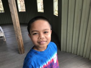 Brayden from World Pediatric Project touring the Garden