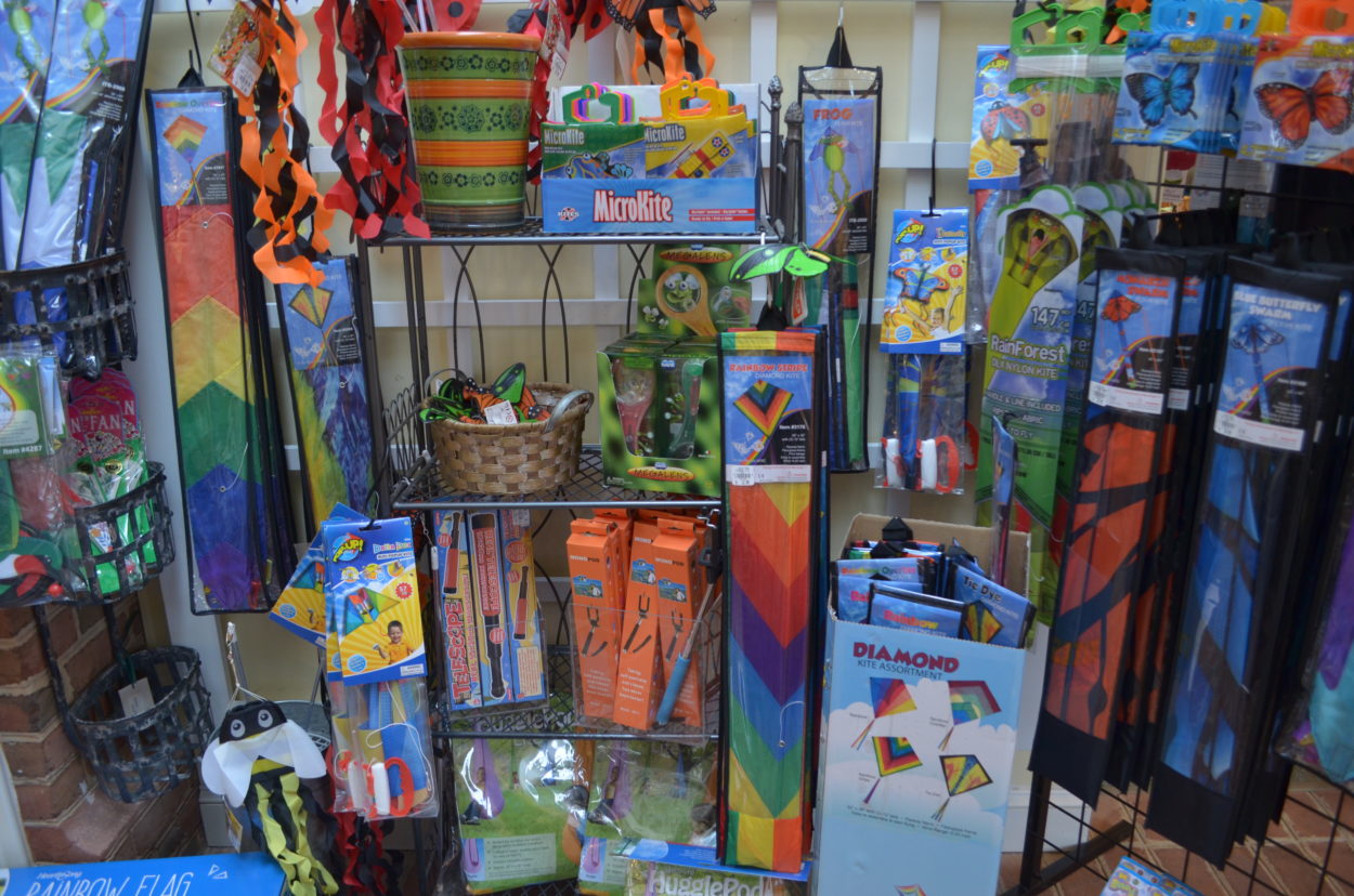 Colorful kites, chalk and other outdoor activities on display. 