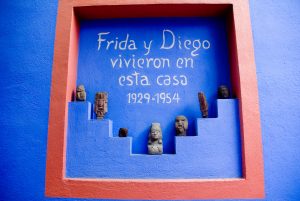Photograph that says in Spanish "Frida and Diego lived in this house 1929-1954" from FRIDA KAHLO’S GARDEN exhibition
