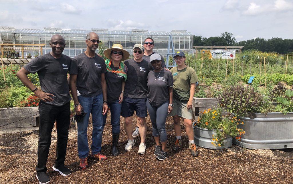 Volunteers from the Fed taking a break from working in the Kroger Community Kitchen Garden