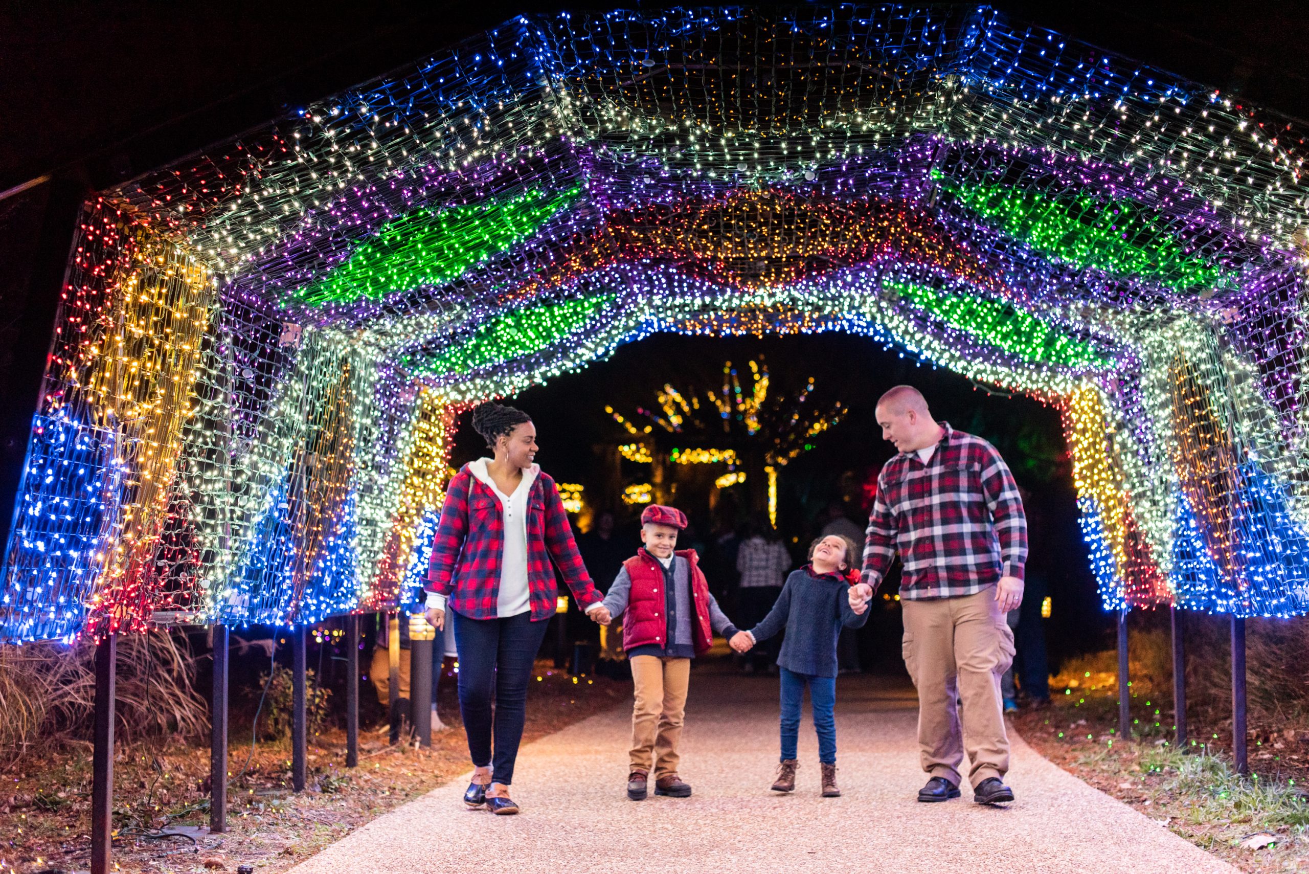 A family enjoying Dominion Energy GardenFest of Lights. Image by Caroline Martin