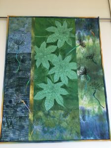 Nature Quilt in green and blue with leaves and seed heads
