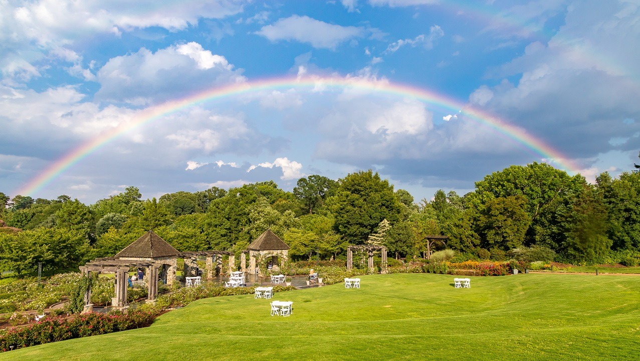 Humans in the Landscape: Heal the Land, Heal Ourselves image of the Garden with a rainbow showing the beauty of the natural world.