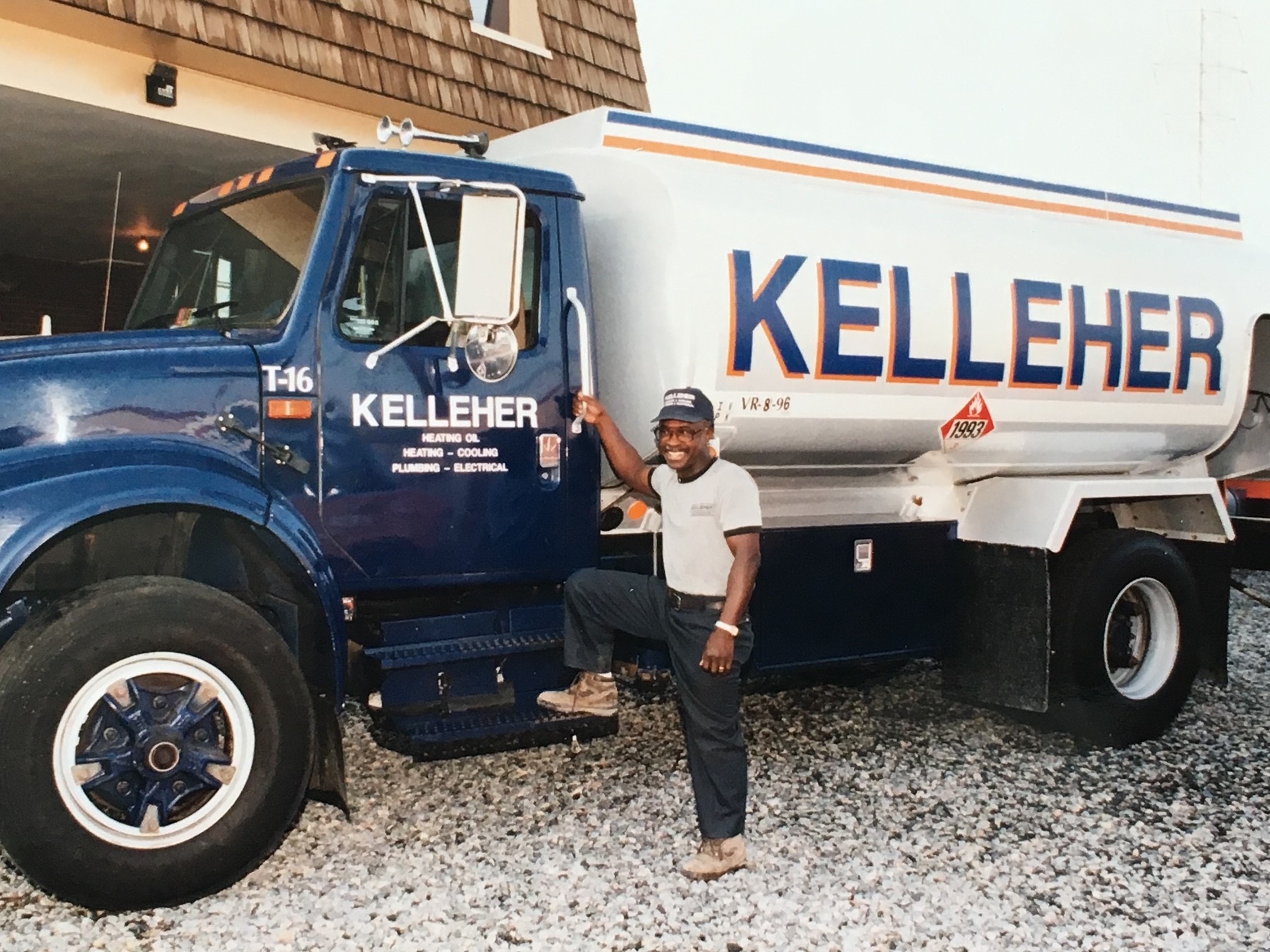 George Noel, fondly known as "Little George" with the oil truck he uses to deliver oil to Kelleher customers 