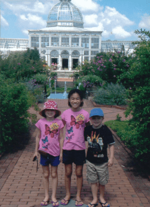 Sasha, Benjamin, and Evelyn in front of the Conservatory