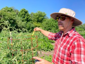 Sustainable Gardener Mikey Partusch and heirloom tomatoes