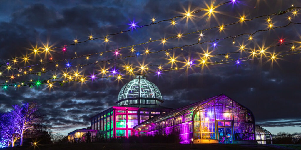 Conservatory view from the Rose Garden during Dominion Energy GardenFest of Lights - by Tom Hennessy